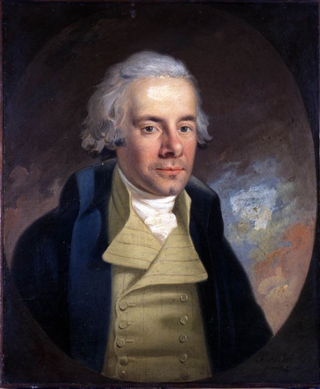 William Wilberforce's portrait: a handsome aristocratic British gentleman wearing the fashion of his time.  He has well-coiffed gray hair and a huge forehead.